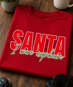 Lustiges Weihnachts-T-Shirt mit dem Spruch SANTA I can explain in roter und grüner Typografie