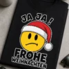 T-Shirt mit dem Spruch „JA JA ! FROHE WEIHNACHTEN“ und skeptischem Smiley mit Weihnachtsmütze